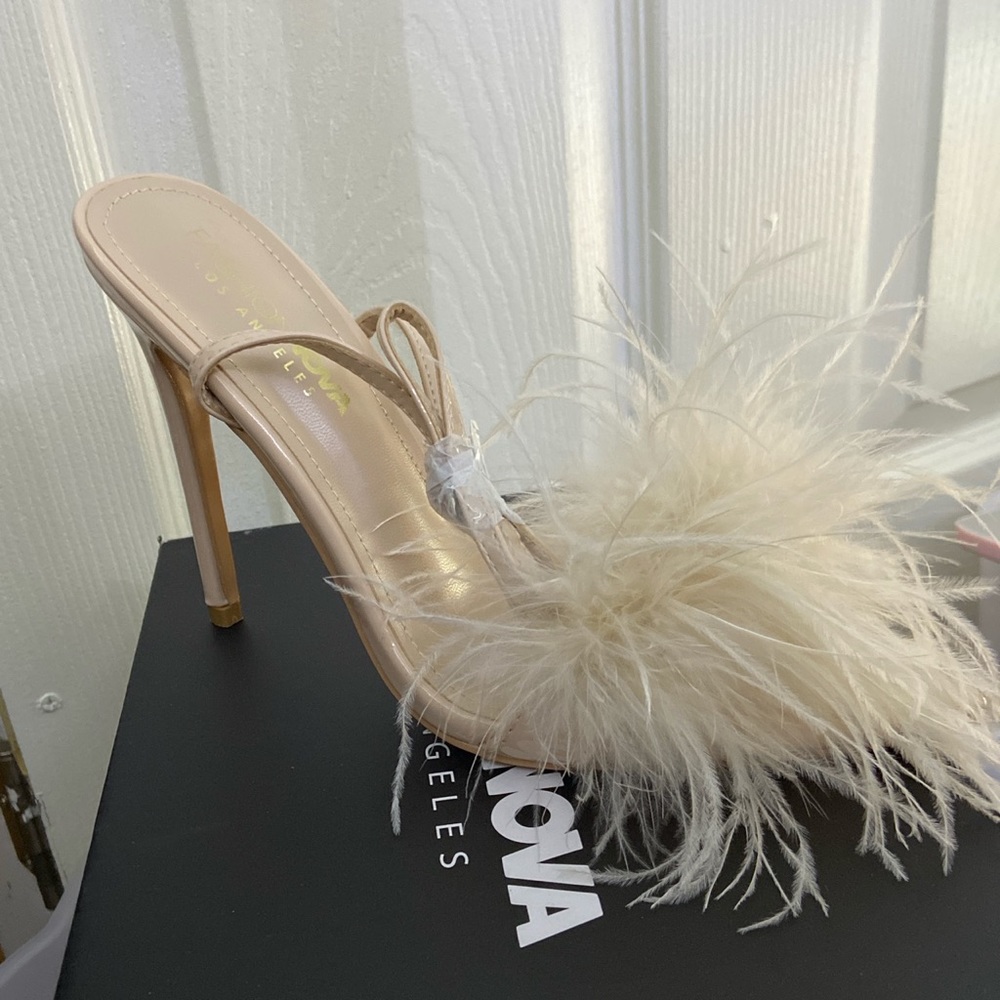 Nude heels with fluff at the toes